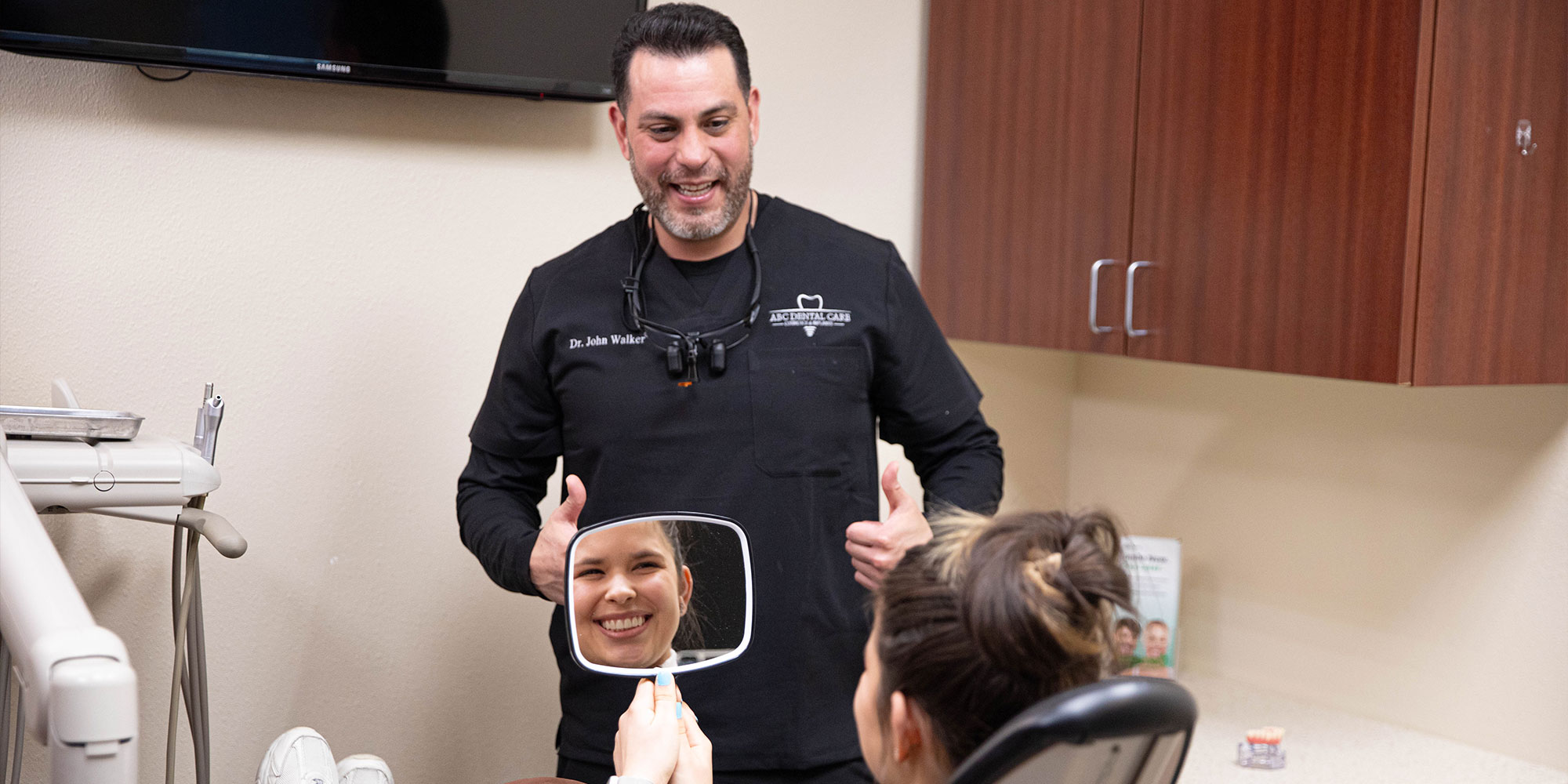 john walker,dds showing patient their new smile