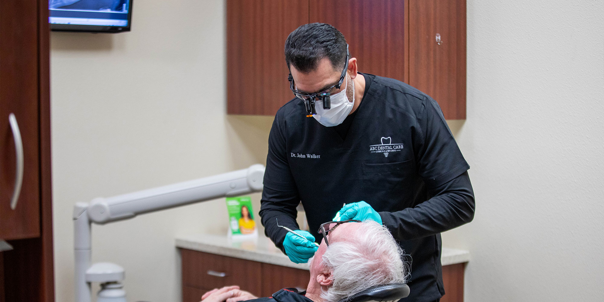 john walker,dds. in the middle of a procedure with patient